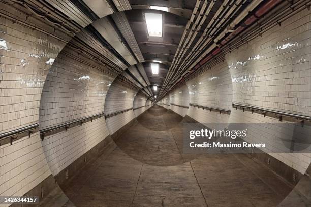 underground walkway with spinning spiral effect - negative photo illusion stock pictures, royalty-free photos & images