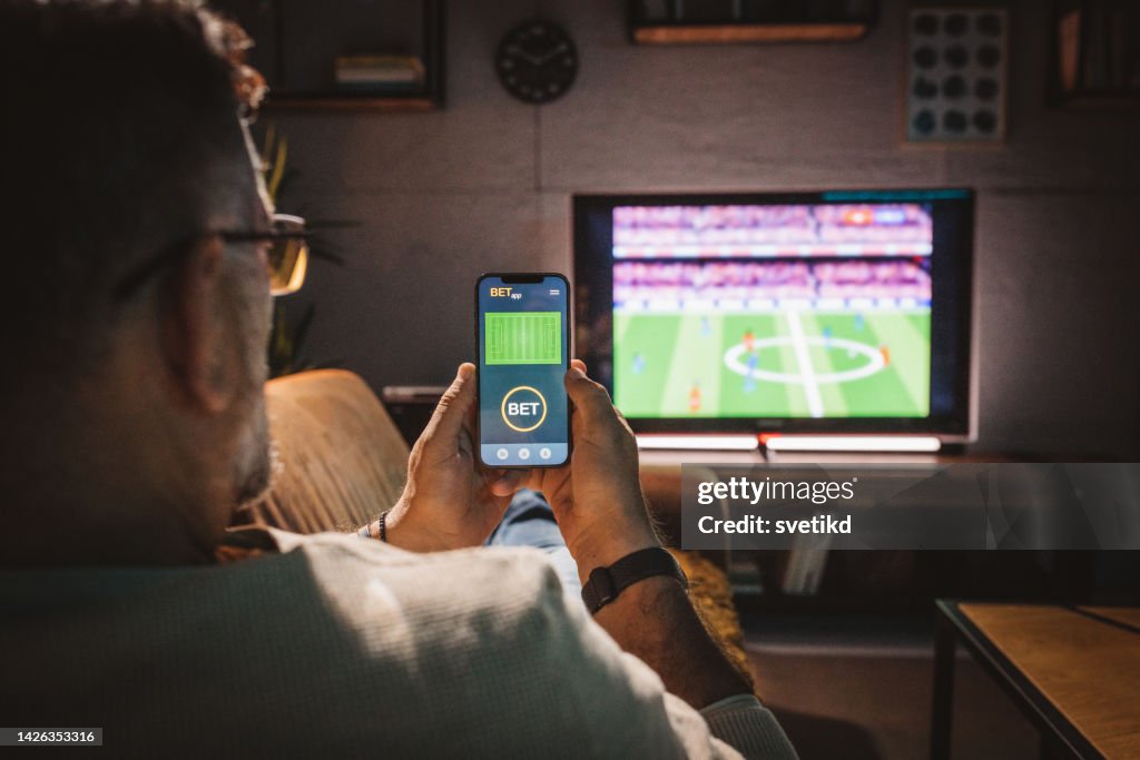 Watching soccer game at home