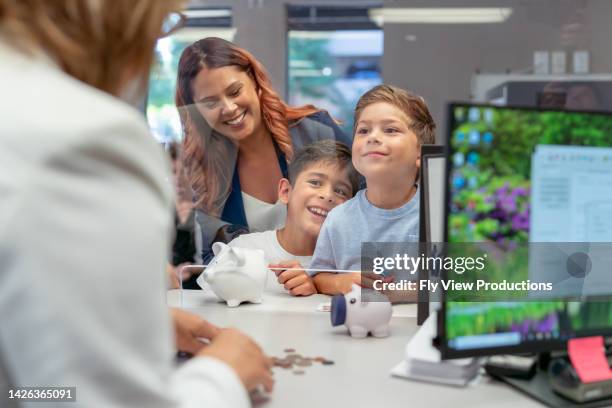 mom teaching her sons about financial responsibility - us penny stock pictures, royalty-free photos & images