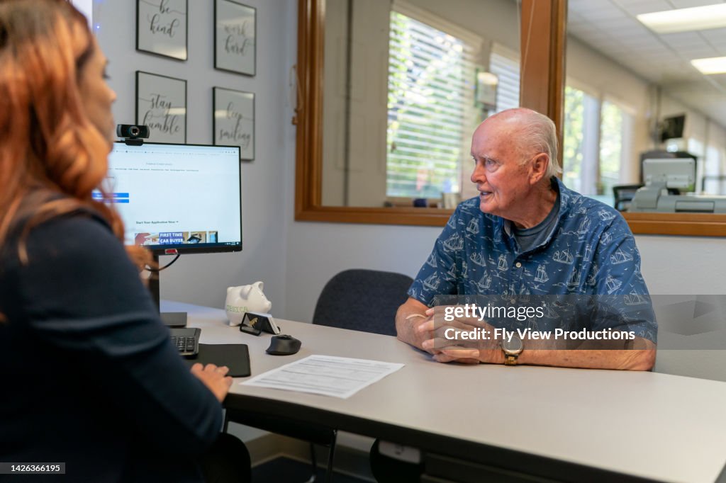 Senior adult man meeting with his financial advisor