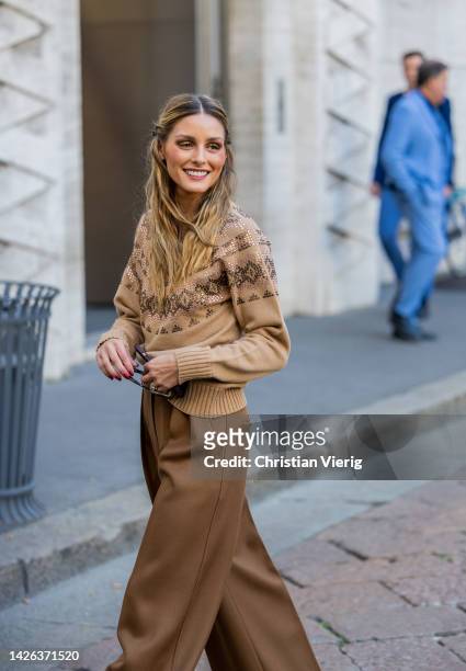Olivia Palermo wears brown pants, beige turtleneck outside Max Mara during the Milan Fashion Week - Womenswear Spring/Summer 2023 on September 22,...