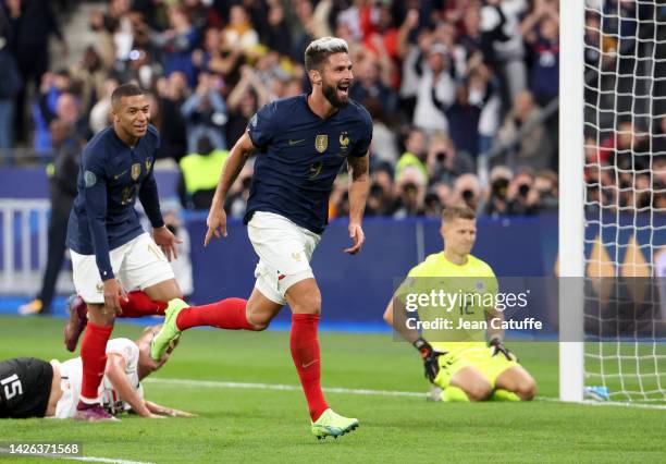 Olivier Giroud of France celebrates his goal, left Kylian Mbappe of France, goalkeeper of Austria Patrick Pentz during the UEFA Nations League League...