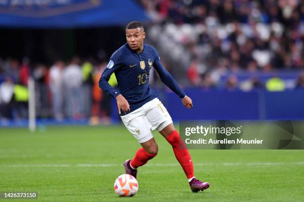 Kylian Mbappe of France runs with the ball during the UEFA Nations League League A Group 1 match between France and Austria at on September 22, 2022...