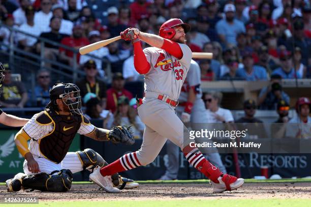 Brendan Donovan of the St. Louis Cardinals connects for a grand slam as Austin Nola of the San Diego Padres looks on during the seventh inning of a...