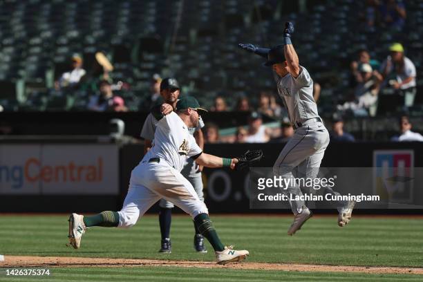 Stephen Vogt of the Oakland Athletics gets the out at first base of Sam Haggerty of the Seattle Mariners in the top of the eighth inning at...
