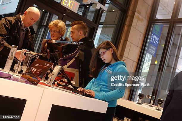 People browse at Sony products at the Sony store on April 10, 2012 in New York City. Sony, the Japanese electronics company, has more than doubled...