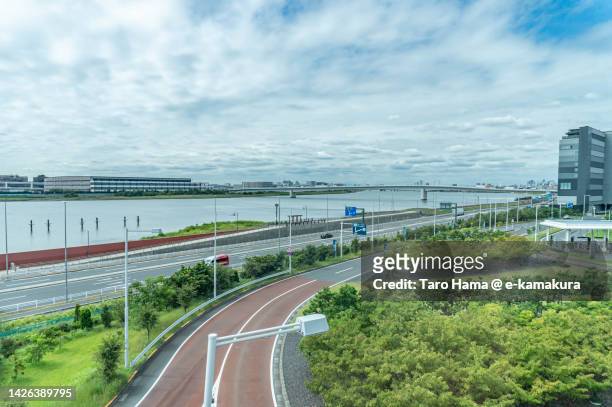 the city road by the river in tokyo of japan - tokyo international airport ストックフォトと画像
