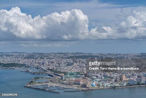 summer clouds over naha city of japan aerial view from airplane - okinawa aerial stock pictures, royalty-free photos & images
