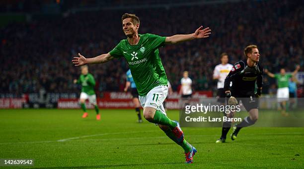 Markus Rosenberg of Bremen celebrates scoring his teams first goal during the Bundesliga match between SV Werder Bremen and Borussia Moenchengladbach...