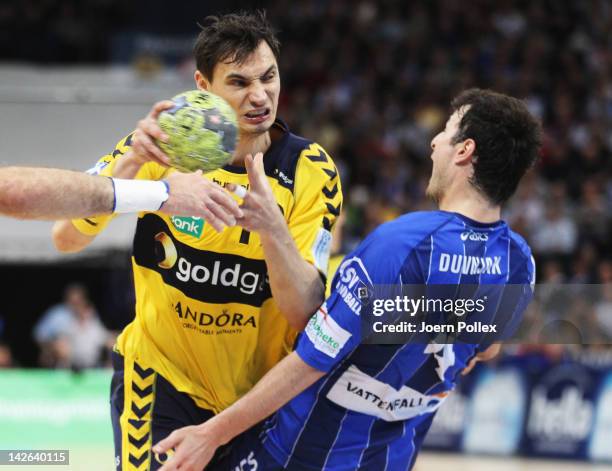 Krzysztof Lijewski of Rhein-Neckar Loewen is challenged by Domagoj Duvnjak of Hamburg during the Toyota Bundesliga handball game between HSV Hamburg...