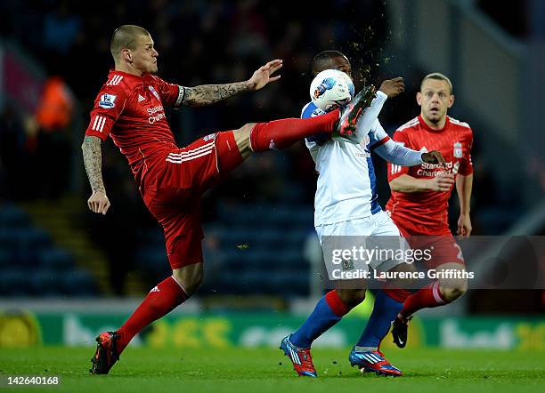 Martin Skrtel of Liverpool competes with Junior Hoilett of Blackburn Rovers during the Barclays Premier League match between Blackburn Rovers and...