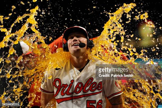 Starting pitcher Kyle Bradish of the Baltimore Orioles is doused with Gatorade after defeating the Houston Astros at Oriole Park at Camden Yards on...