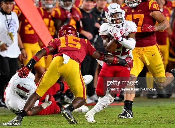 Running back Malik Sherrod of the Fresno State Bulldogs defensive back Anthony Beavers Jr. #15 of the USC Trojans for a first down in the second half...