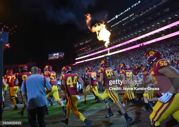 Trojans players run on to the field for the game against the Fresno State Bulldogs at United Airlines Field at the Los Angeles Memorial Coliseum on...