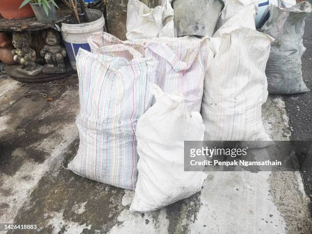 stacked sandbags - sandbag stock pictures, royalty-free photos & images