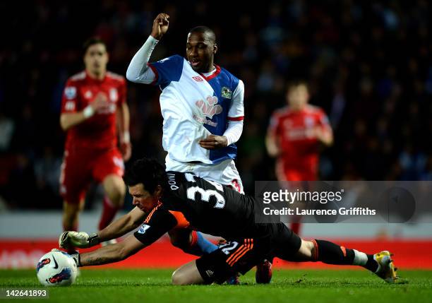 Alexander Doni of Liverpool brings down Junior Hoilett of Blackburn Rovers to concede a peanlty during the Barclays Premier League match between...