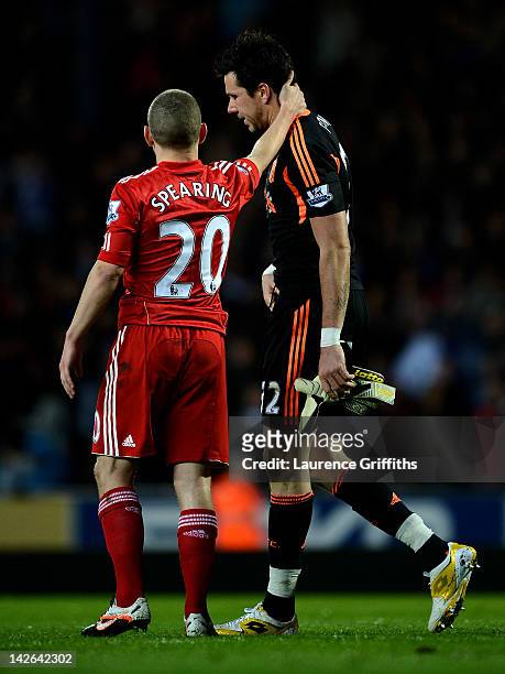 Alexander Doni of Liverpool is consoled by team mate Jay Spearing after being sent off during the Barclays Premier League match between Blackburn...