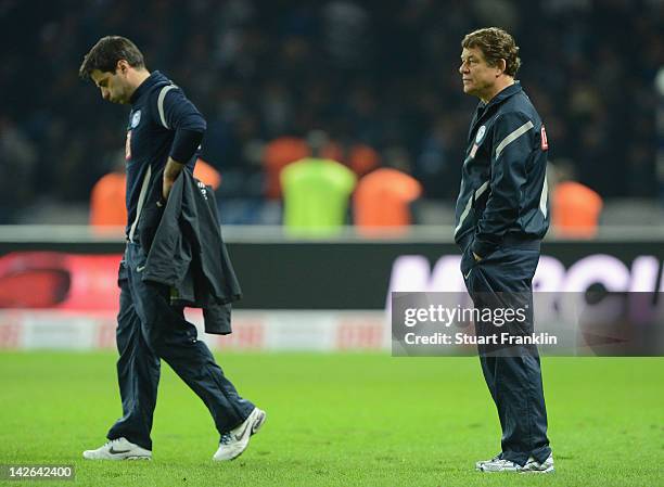 Otto Rehhagel, head coach of Berlin and his assistant Rene Tretschok, look dejected at the end of the Bundesliga match between Hertha BSC Berlin and...