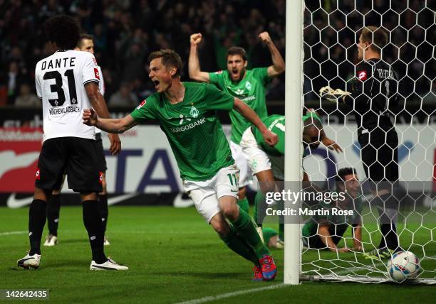 Markus Rosenberg of Bremen celebrate his team's equalizing goal during the Bundesliga match between SV Werder Bremen and Borussia Moenchengladbach at...