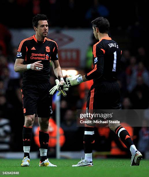 Alexander Doni of Liverpool hands the gloves to Brad Jones after being sent off during the Barclays Premier League match between Blackburn Rovers and...