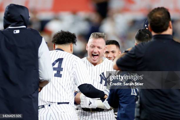 Josh Donaldson of the New York Yankees reacts after hitting a walk-off single during the tenth inning against the Boston Red Sox at Yankee Stadium on...