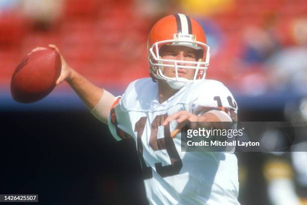 Bernie Kosar of the Cleveland Browns looks to throw a pass during a football game against the Pittsburgh Steelers on October 15, 1986 at Three Rivers...