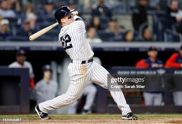 Harrison Bader of the New York Yankees hits a sacrifice fly allowing Tim Locastro to score during the eighth inning against the Boston Red Sox at...