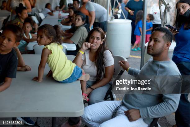 Dainelys Soto, Genesis Contreras, and Daniel Soto, who two days ago arrived from Venezuela after crossing the U.S. Border from Mexico, wait for...