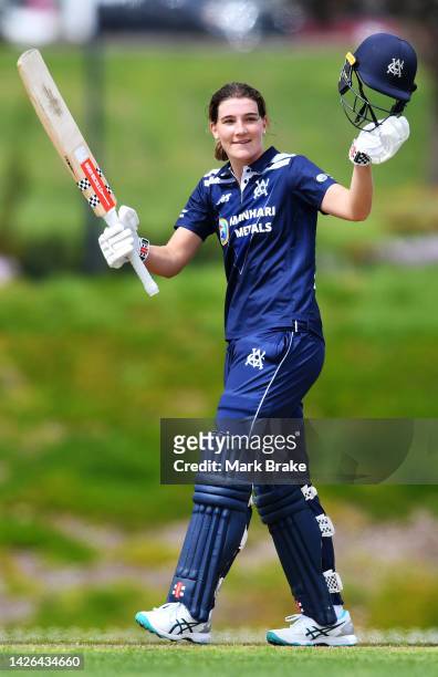 Annabel Sutherland of Victoria celebrates bringing up her century during the WNCL match between South Australia and Victoria at Karen Rolton Oval, on...