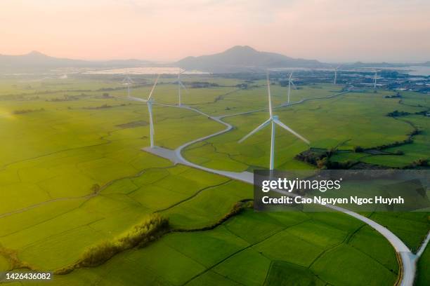 wind electricity - agricultural building stock pictures, royalty-free photos & images