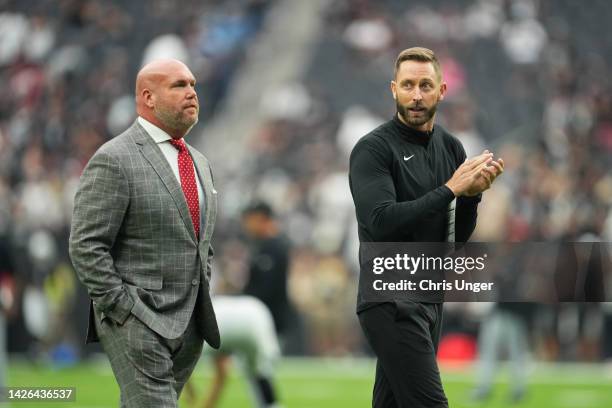 Head coach Kliff Kingsbury and general manager Steve Keim of the Arizona Cardinals look on during warmups before a game against the Las Vegas Raiders...