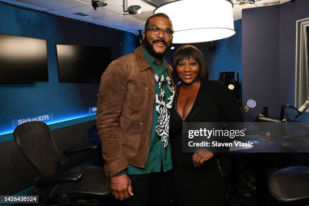 Tyler Perry and host Bevy Smith pose for photos at Radio Andy at SiriusXM Studios on September 22, 2022 in New York City.