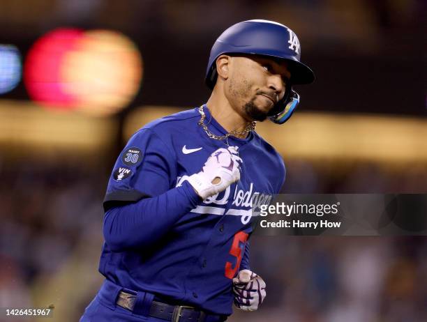 Mookie Betts of the Los Angeles Dodgers reacts to his walk off single, for a 3-2 win over the Arizona Diamondbacks, during the ninth inning at Dodger...