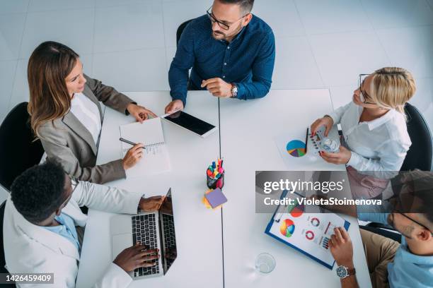 business persons on meeting in the office. - working on laptop in train top view stock pictures, royalty-free photos & images