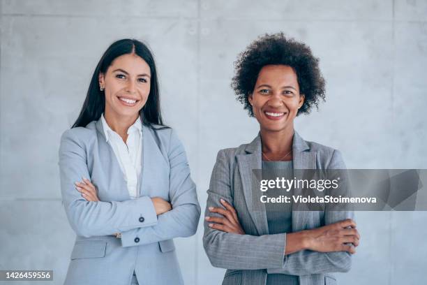 successful female business team. - two people standing stock pictures, royalty-free photos & images