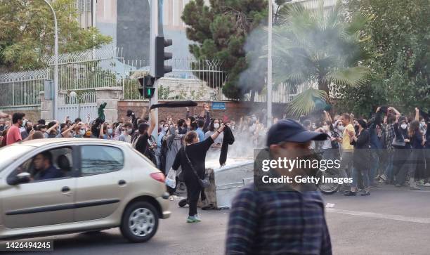 People gather in protest against the death of Mahsa Amini along the streets on September 19, 2022 in Tehran, Iran. 22-year-old Mahsa Amini fell into...