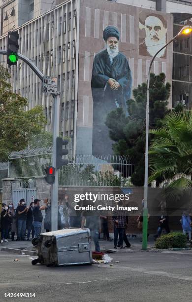 People gather in protest against the death of Mahsa Amini along the streets on September 19, 2022 in Tehran, Iran. 22-year-old Mahsa Amini fell into...