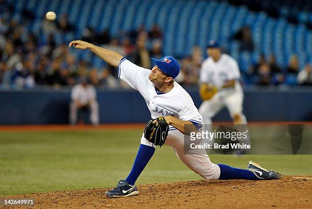 Casey Janssen of the Toronto Blue Jays delivers a pitch during MLB game action against the Boston Red Sox April 10, 2012 at Rogers Centre in Toronto,...