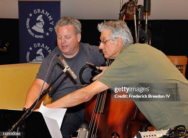 Bassist Mike Bub and drummer Larry Atamanuik look at a chart during the GRAMMY U: In The Studio at Ben's Studio on April 10, 2012 in Nashville,...