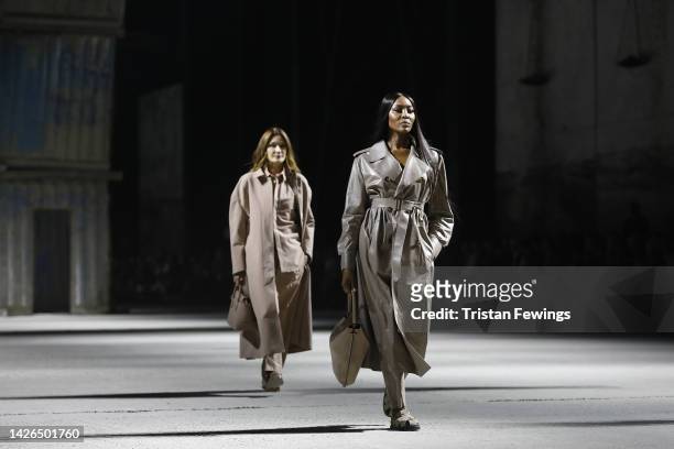 Carla Bruni and Naomi Campbell walk the runway of the Tod's Fashion Show during the Milan Fashion Week Womenswear Spring/Summer 2023 on September 23,...