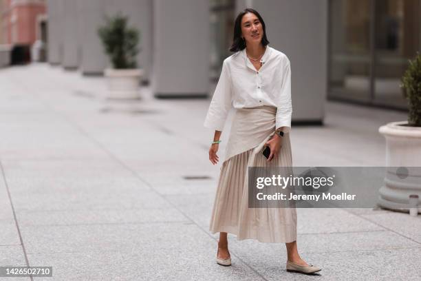 Eva Chen seen wearing a white and beige look, outside peter do during New York Fashion Week on September 13, 2022 in New York City.