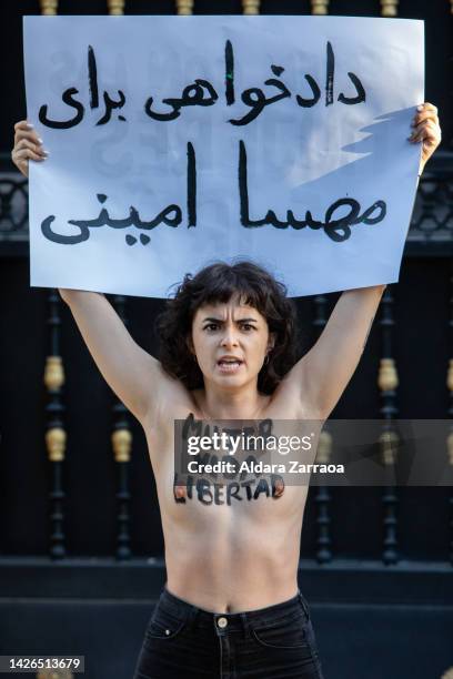 Member of the women's rights organization Femen protests in front of the Iranian Embassy on September 23, 2022 in Madrid, Spain. Femen activists are...