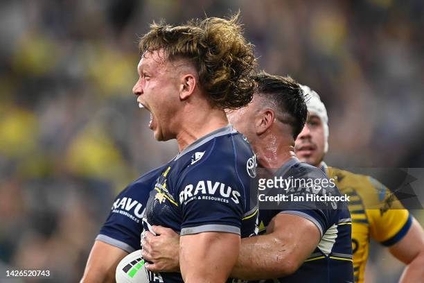 Reuben Cotter of the Cowboys celebrates with team mates after scoring a try during the NRL Preliminary Final match between the North Queensland...