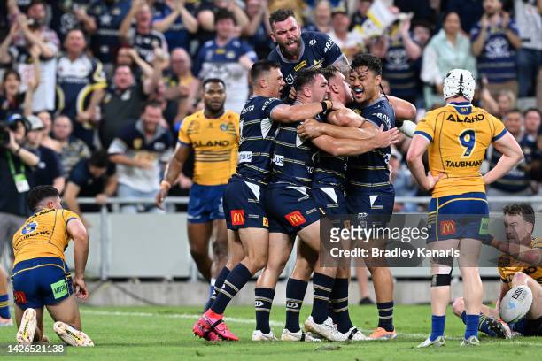 Reuben Cotter of the Cowboys celebrates a try with team mates during the NRL Preliminary Final match between the North Queensland Cowboys and the...