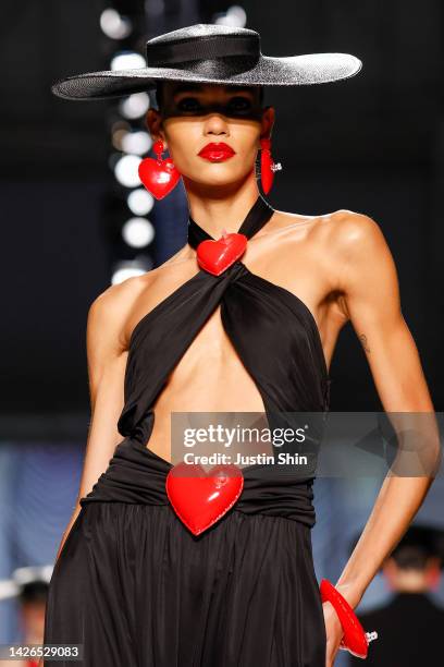 Model, accessory detail, walks the runway of the Moschino Fashion Show during the Milan Fashion Week Womenswear Spring/Summer 2023 on September 22,...