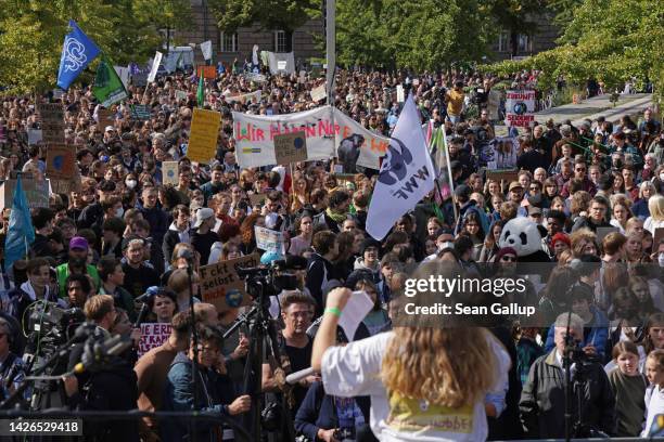 Supporters of the Fridays for Future climate action movement gather for speeches before marching during a global climate strike on September 23, 2022...