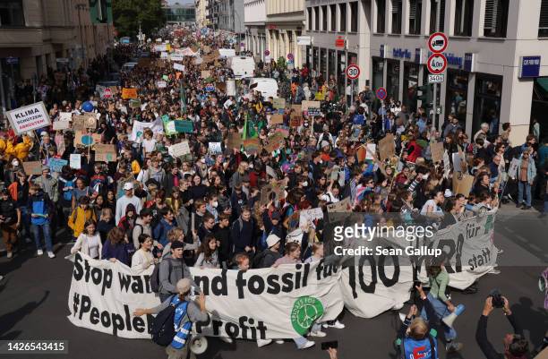 Supporters of the Fridays for Future climate action movement march during a global climate strike on September 23, 2022 in Berlin, Germany. Similar...