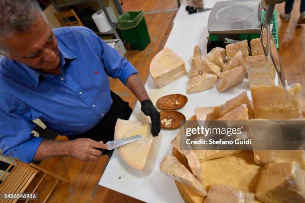 Parmigiano Reggiano producer inside of Terra Madre - Salone Del Gusto 2022 on September 22, 2022 in Turin, Italy.