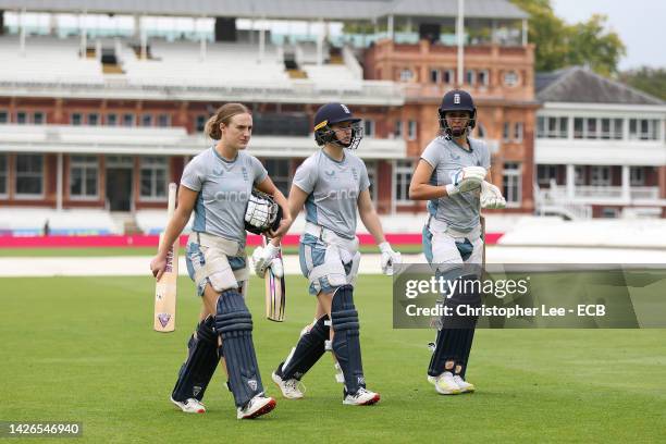 Emma Lamb, Charlie Dean and Maia Bouchier of England walk out to net during the England Nets Session at Lord's Cricket Ground on September 23, 2022...