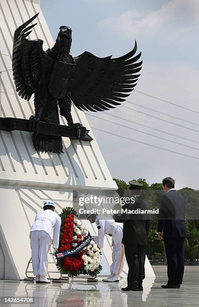 Prime Minister David Cameron watches as a wreath is placed at The Kalibata National Hero Cemetary on April 11, 2012 in Jakarta, Indonesia. Mr Cameron...